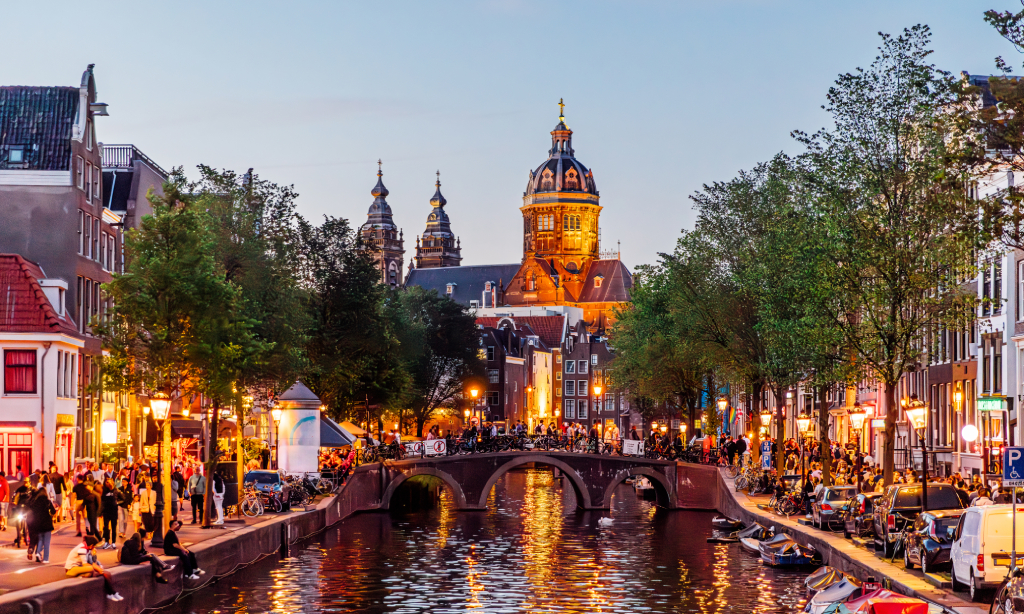 View of a river in Amsterdam showing overtourism of the area.
